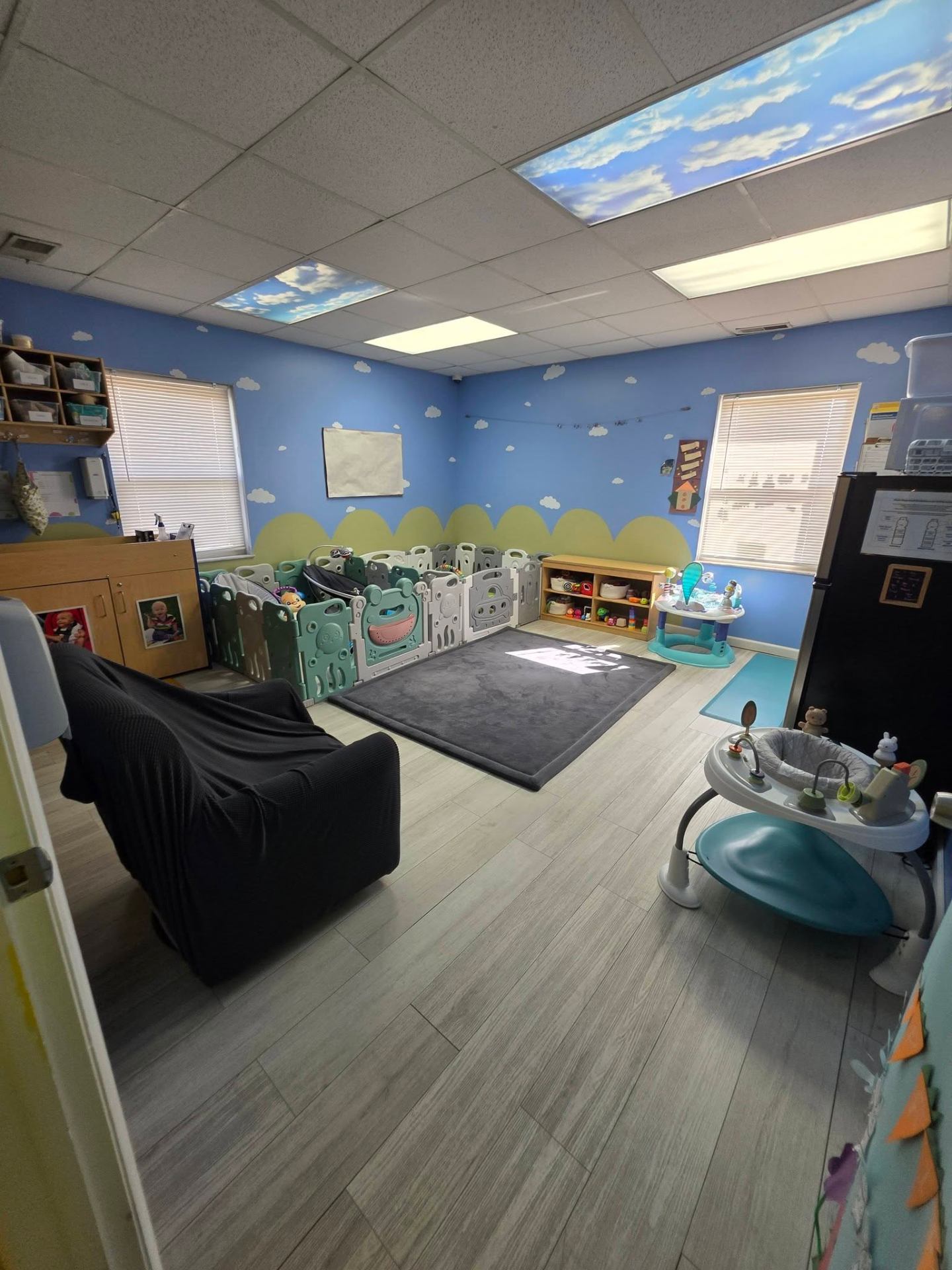 The Bumblebee infant room with sky blue walls and soft play area